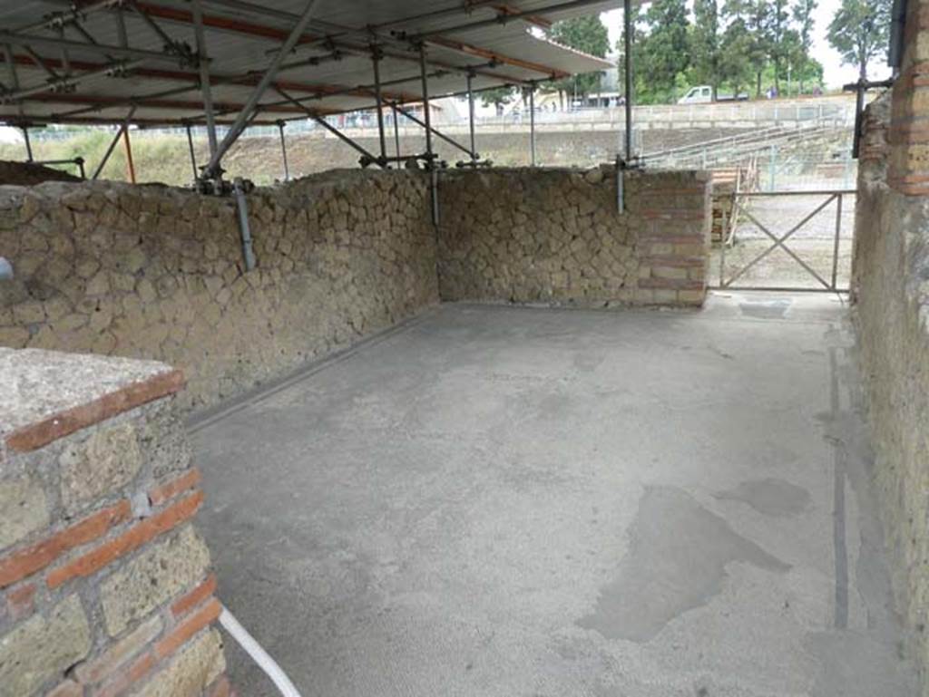 III.1 Herculaneum, September 2015. Room 24, looking south. 
According to Guidobaldi, on the south side of the peristyle were the most prestigious reception and living rooms (rooms 23, 24, 25 and 26).
With the sole exception of oecus 26, the others all looked out onto the large southern terrace with massive square pillars (22), largely collapsed by the failure of the vaults below. 
See Guidobaldi, M.P, 2009: Ercolano, guida agli scavi. Naples, Electa Napoli, (p.58).